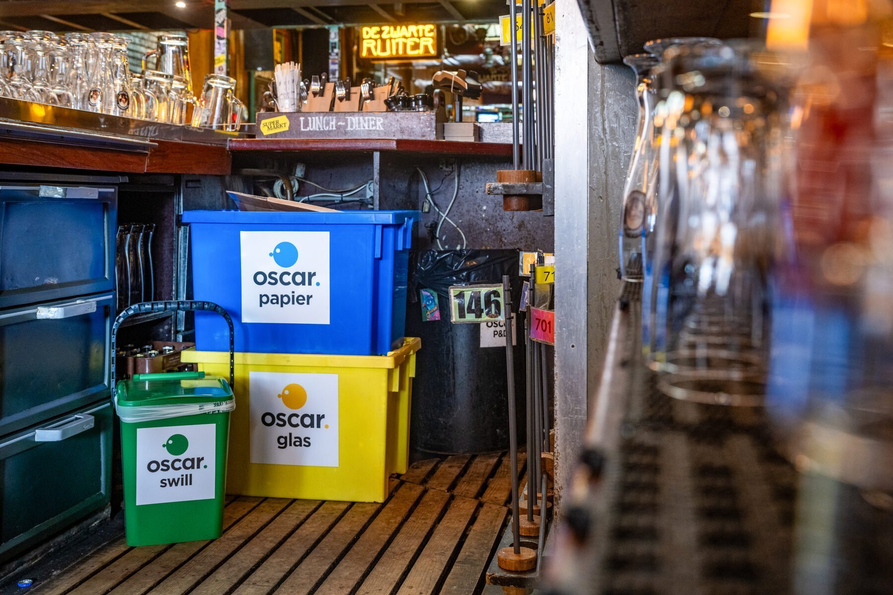 Oscar Circulair paper, glass and swill collection bins stored neatly inside a hospitality venue
